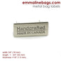 Metal Bag Label: "Handcrafted - Made in Canada"